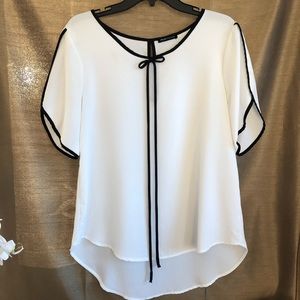 White flowy blouse by Jella Couture